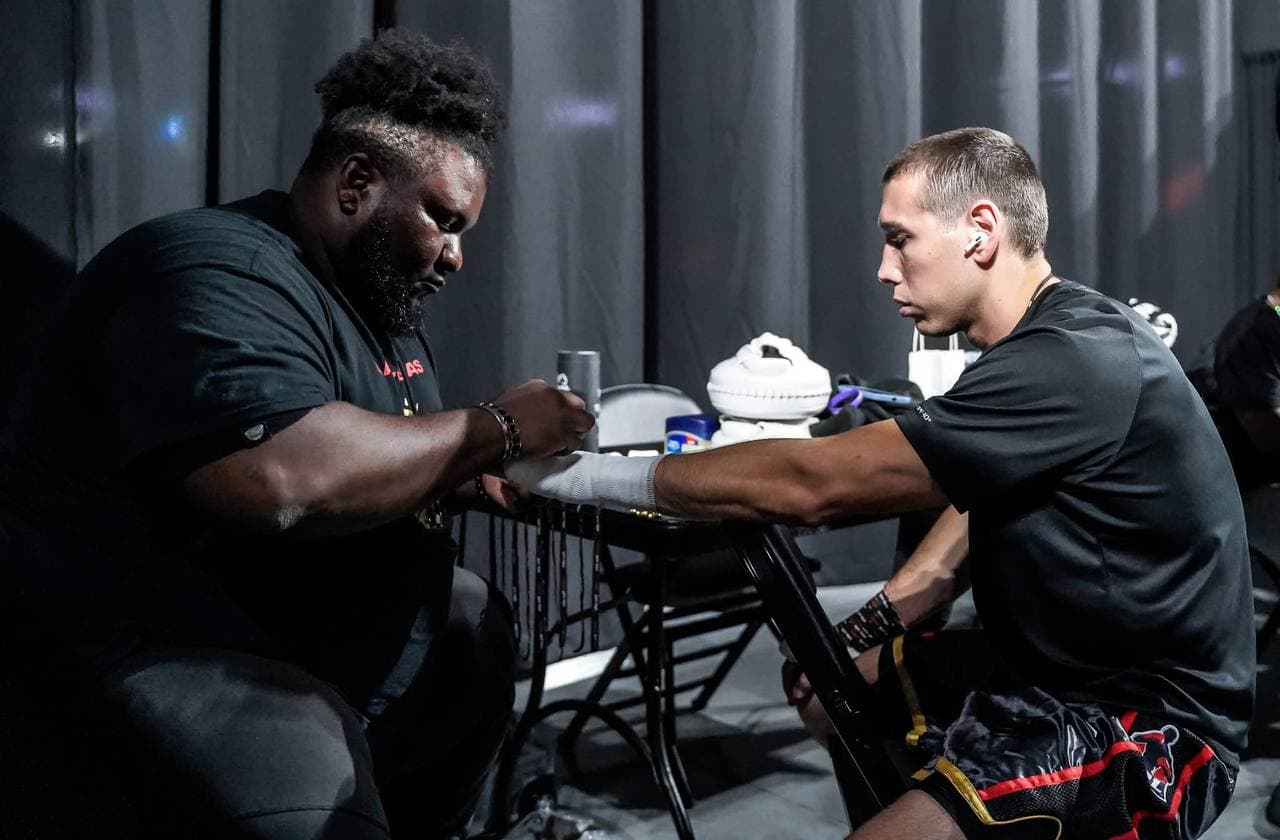 Hand wraps before a pro fight — Artem Brusov backstage