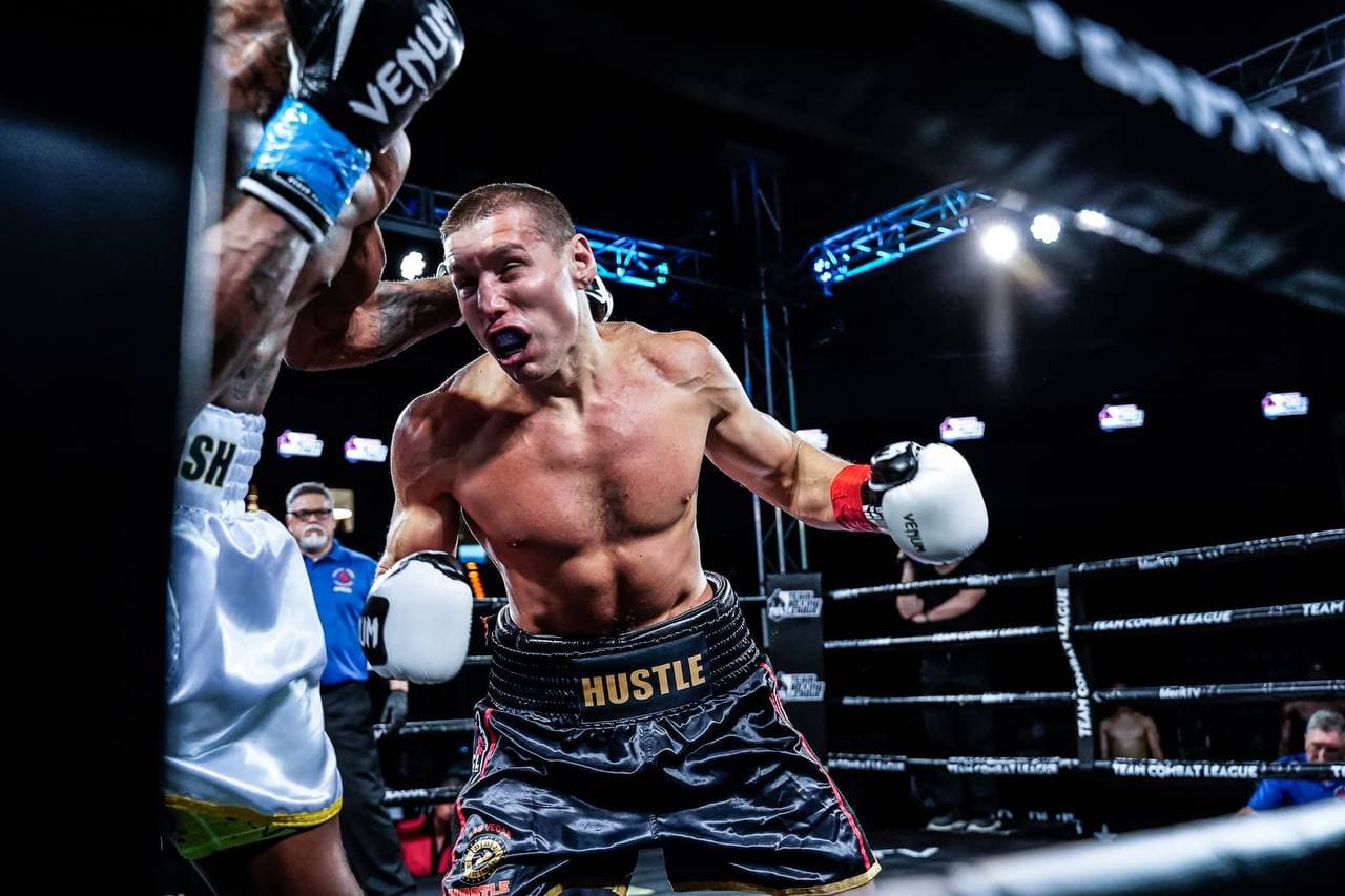Artem Brusov landing a jab — Team Combat League pro fight